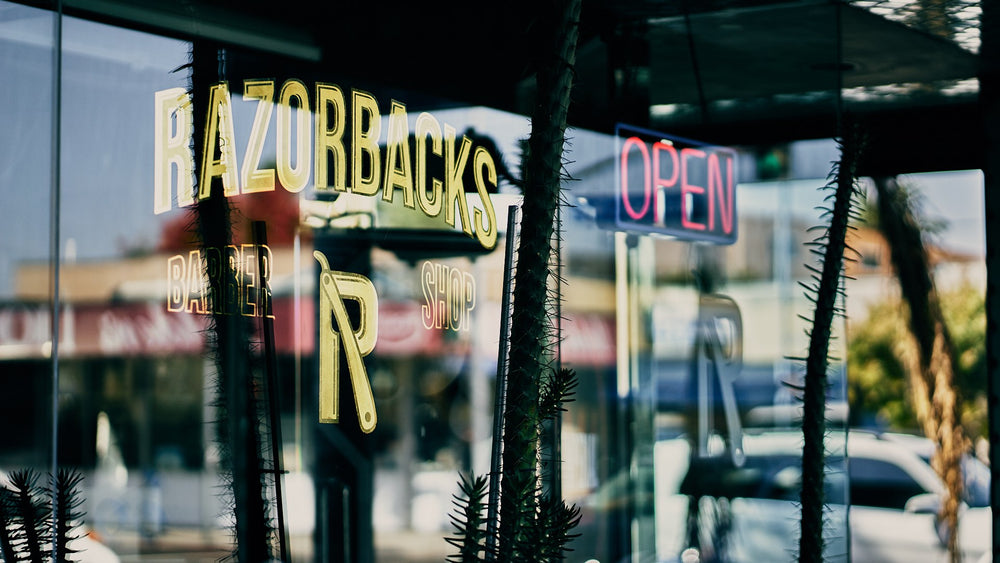 Razorbacks Barber Shop window sign and open sign